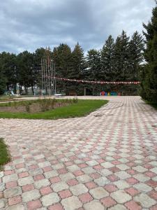 a large brick road with a string of lights at Сруб на Иссык Куле in Chon-Sary-Oy