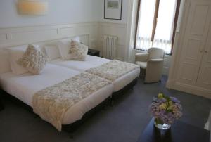 Postel nebo postele na pokoji v ubytování Hotel Olajauregi