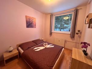 Una cama o camas en una habitación de Apartmán Horalka Donovaly