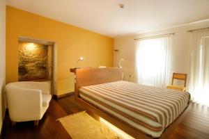 Uma cama ou camas num quarto em Casa Dos Poos