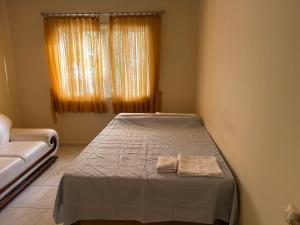 Chalet Sol Nascente tesisinde bir odada yatak veya yataklar