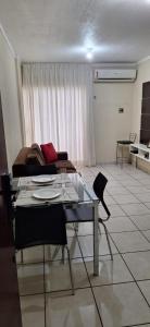 a living room with a table and chairs and a couch at 507 - Apto completo p temporada ou negócios - PVH in Porto Velho +7 photos