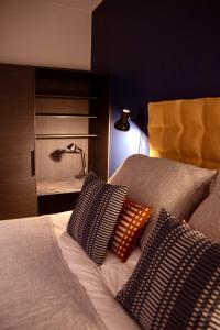 a bedroom with a bed with two pillows on it at Chalet Auroras - Top quality 2 bdr chalet in prime location of Levi in Levi