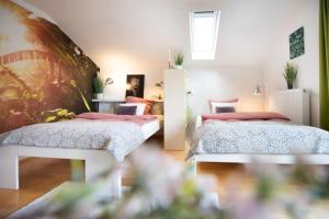 Einzigartige Auszeit mit Bergblick in Bad Tölz tesisinde bir odada yatak veya yataklar