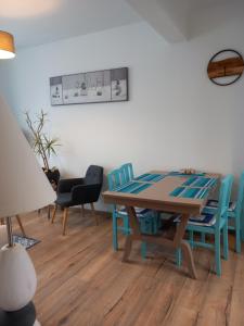 a dining room with a table and chairs at THALASSA in Audresselles