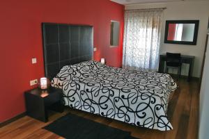 Uma cama ou camas num quarto em Casa Dos Poos