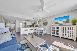 a living room with a couch and a table at Pelican Beach Resort Unit 1109 in Destin