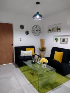 a living room with a couch and a table at Departamento en Heroica Matamoros in Matamoros