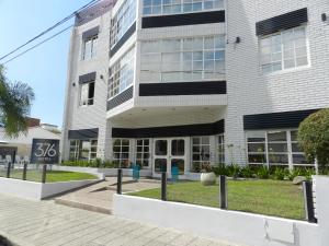 a building with a sign in front of it at Hotel 376 in Villa Carlos Paz