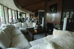 a living room with a white couch and a table at Roundhouse Grotto in Calgary