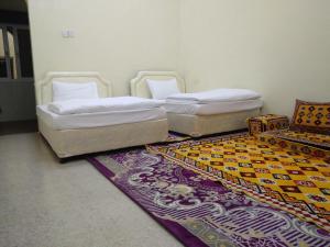 Postel nebo postele na pokoji v ubytování Hotel Ain Safnan Room&Flats فندق عين صفنان غرف&شقق