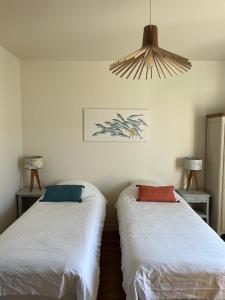 Posteľ alebo postele v izbe v ubytovaní Les Bains de Trouville