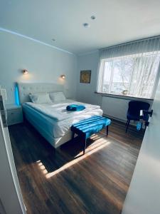 a bedroom with a bed and a table in it at Easy Stay in Keflavík