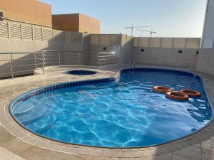 a large swimming pool on top of a building at Master Room with attach Bathroom Near Mall of the Emirates in Dubai
