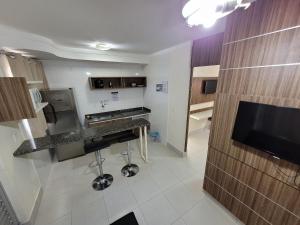 a kitchen with a sink and a counter top at Lacqua diRoma RM Hospedagem in Caldas Novas