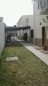 an empty yard next to a building at Acutun in Mar de Ajó
