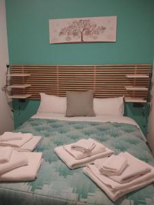 Giường trong phòng chung tại il Sole di Busto APT