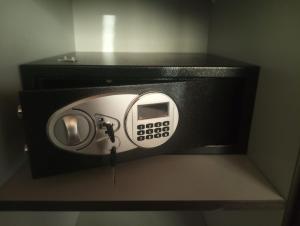 a soap dispenser in a black box in a bathroom at Mansarda Monache (M&M) in Bitetto