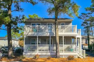 a large white house with a large balcony at Ocean City Townhome by Beach Bayside in Ocean City