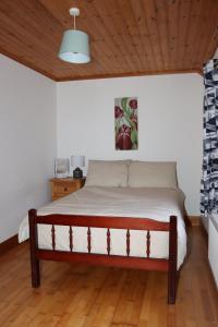Ένα ή περισσότερα κρεβάτια σε δωμάτιο στο Biddy Rua's Place
