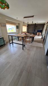 a large dining room with wooden tables in a room at CUNCUMEN Caviahue in Caviahue