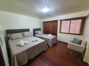Katil atau katil-katil dalam bilik di Aconchegante no centro de Nova Friburgo