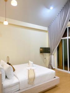 Postel nebo postele na pokoji v ubytování Chokdee Resort