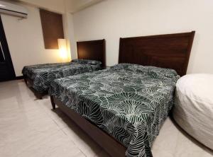 Postel nebo postele na pokoji v ubytování Lin's B&B