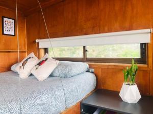 Postel nebo postele na pokoji v ubytování Tinyhouse in the WineValley