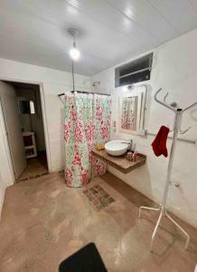 a bathroom with a sink and a shower curtain at Departamento en San Francisco Isabel in San Francisco