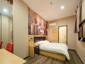 Lova arba lovos apgyvendinimo įstaigoje Thank Inn Chain Hotel jiangxi nanchang west lake district August 1st plaza