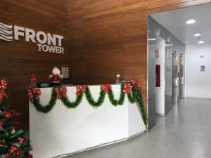 a front counter with christmas decorations in a hallway at Albano, Ocean view and pool near Miraflores and airport in Lima