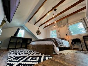 a bedroom with a large bed in a attic at Private NE Portland Guesthouse in Portland