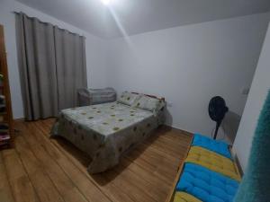 Katil atau katil-katil dalam bilik di Lugar tranquilo e aconchegante