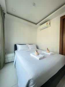 Postel nebo postele na pokoji v ubytování Arcadia Beach Continental + 31 fotografií