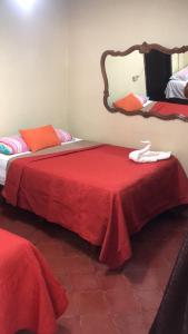 Postel nebo postele na pokoji v ubytování Hotel Marjenny