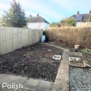 a garden in front of a fence at Tsalach Short Lets in Nottingham