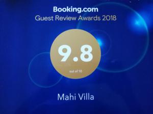 a sign that reads guest review awards villa at Mahi Villa in Bentota