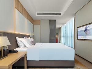 Letto o letti in una camera di Echeng Hotel - Huawei Base Store in Shenzhen