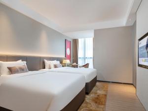 Letto o letti in una camera di Echeng Hotel - Huawei Base Store in Shenzhen