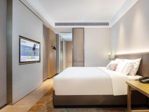 Letto o letti in una camera di Echeng Hotel - Huawei Base Store in Shenzhen