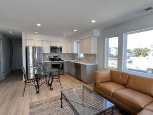 a living room with a couch and a table at Agresti Mil in Brant Beach
