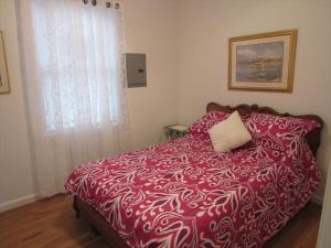 Postel nebo postele na pokoji v ubytování Oceanblock Cottage