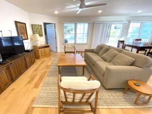 a living room with a couch and a tv at Family Friendly Vacation Rental On Lbi in Beach Haven