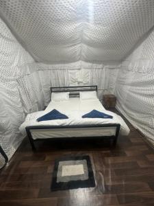 a bedroom with a bed in a tent at Sari Highlands in Sari