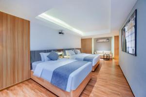 Postel nebo postele na pokoji v ubytování Shangpin Holiday Inn - Guangzhou New Baiyun International Airport Flagship Store