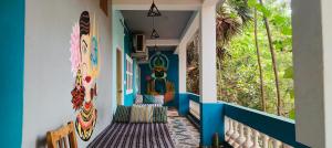 a home hallway with surfboards on the wall at Unearth Hostel (Pondicherry) in Auroville