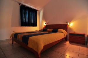 Łóżko lub łóżka w pokoju w obiekcie Apartments Livia