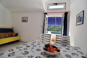Łóżko lub łóżka w pokoju w obiekcie Apartments Livia