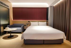 Katil atau katil-katil dalam bilik di Maison New Century Tongxiang